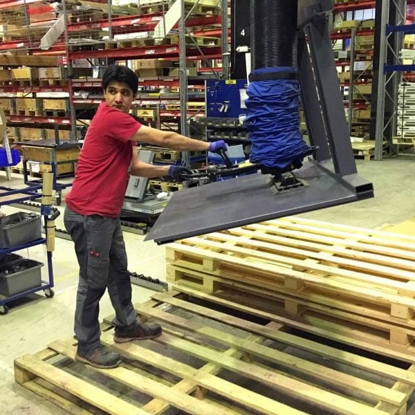 Metal Parts being lifted with a vacuum lifter