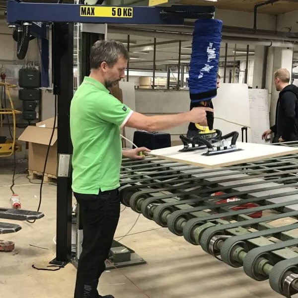 Kitchen Appliances, vacuum lifter being used by a single operator lifting counter top, cabinets