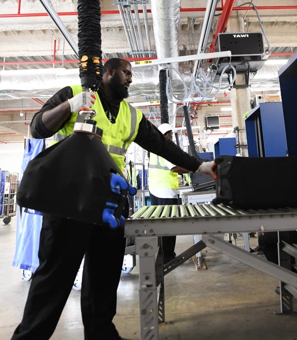 TAWI Baggage Lifts minimize work related strain injuries