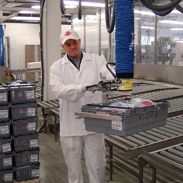 Crate Lifting, crate with raw food and meat being lifted by a vacuum lifter and a single operator