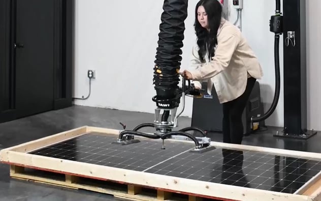 Incoming deliveries of solar panels require careful unloading and movement to prevent transit damage.