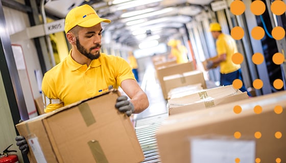 Warehouse operator lifting boxes manually