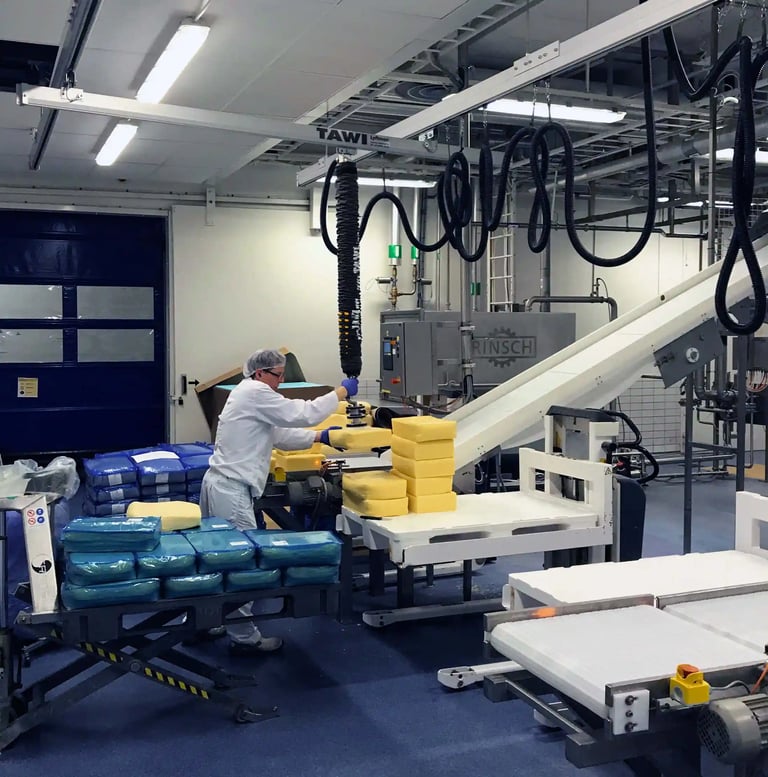 Lifting cheese with TAWI vacuum lifter
