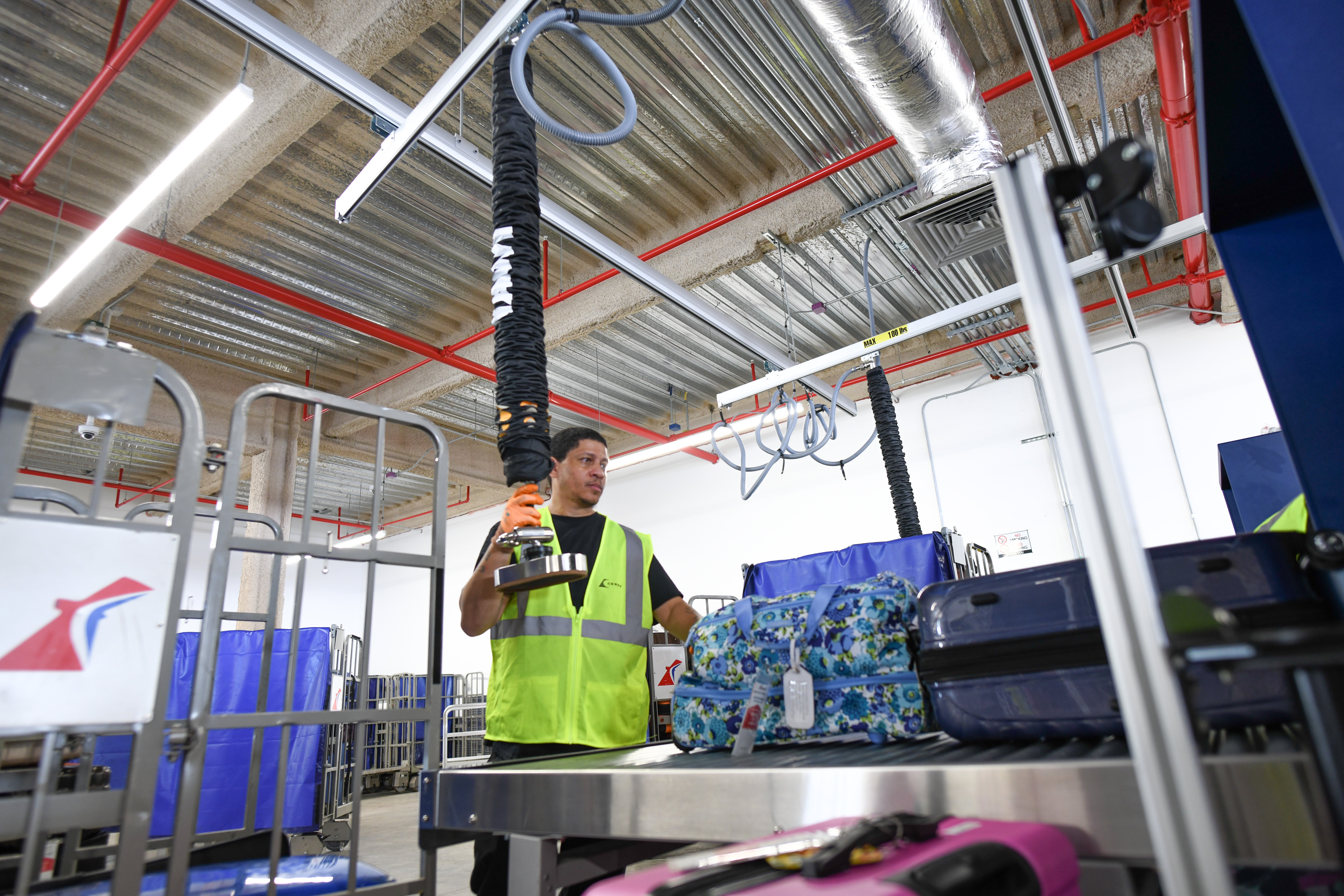 Worker handling baggage at Ceres Airport