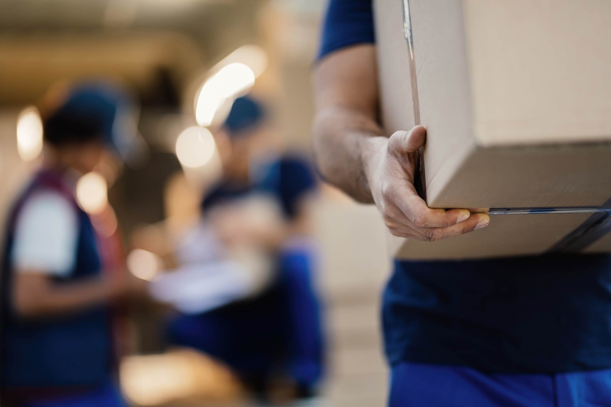 Manual handling of lifting and carrying boxes in a warehouse 