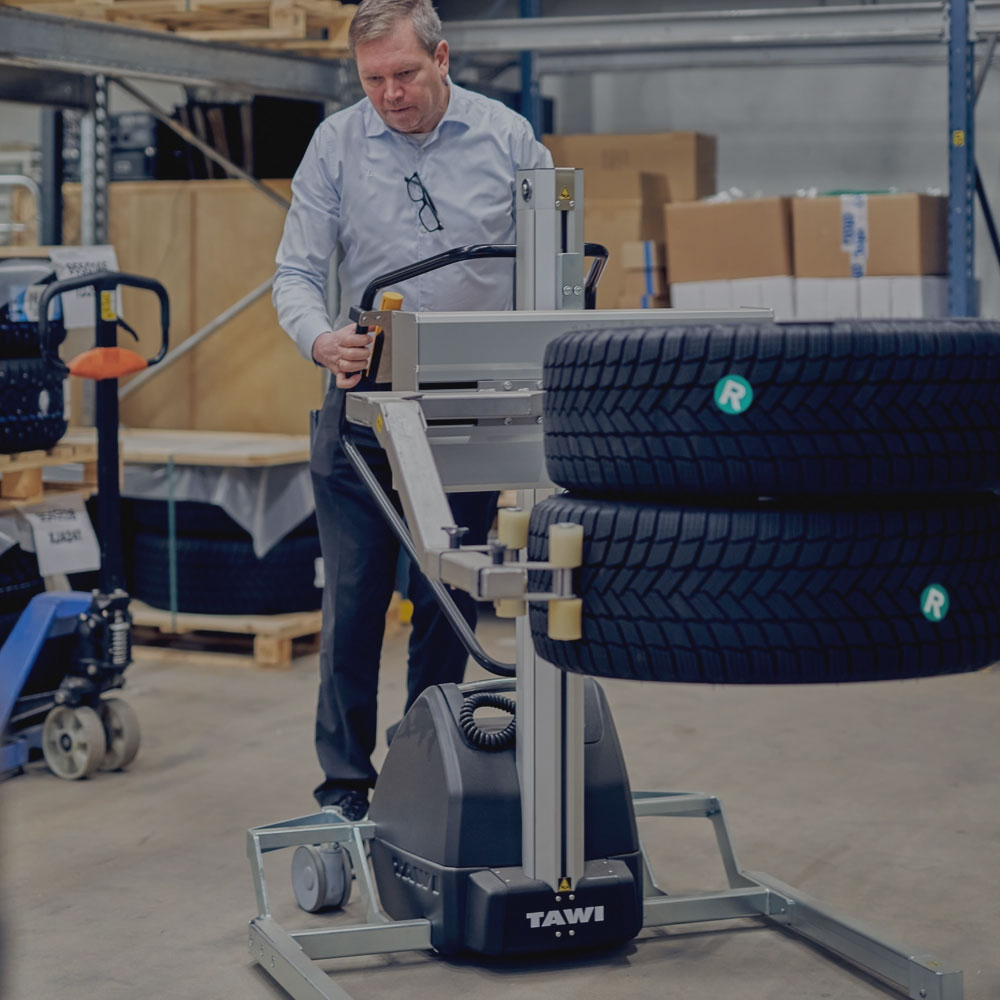 Portable Lifting Trolley lifting tyres in an automotive components warehouse