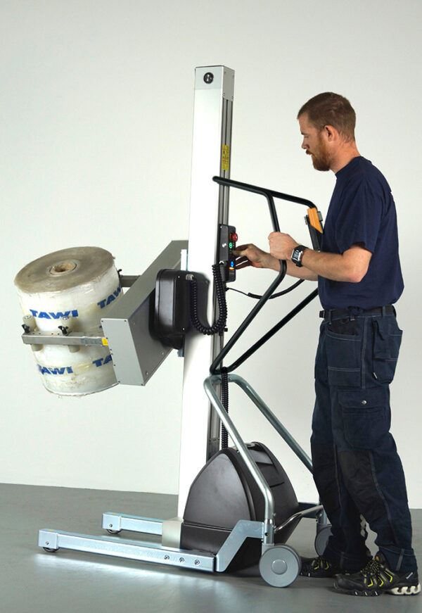 man lifting and turning roll in handhold lifting trolley