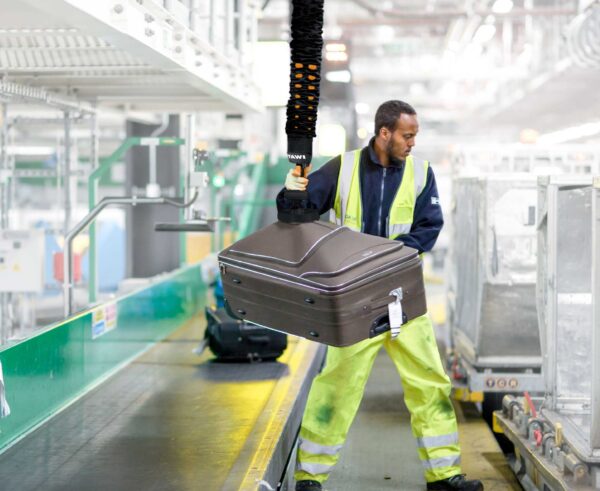 TAWI handheld high-frequency vacuum lifter used to lift baggage at airports.