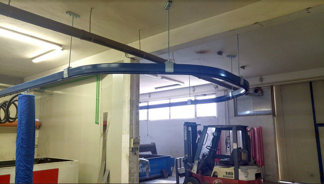 Overhead crane system with curved monorail modules