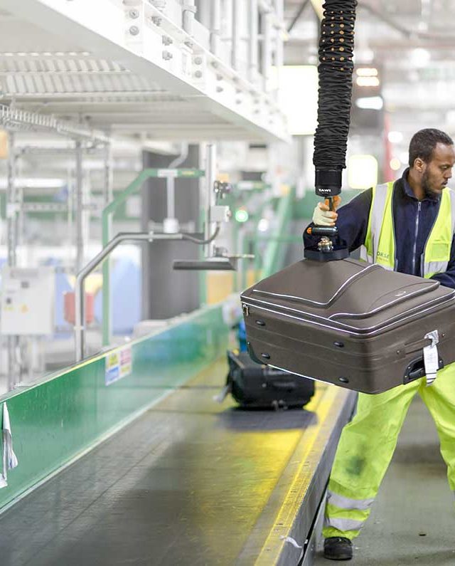 Lifting baggage at airport terminal