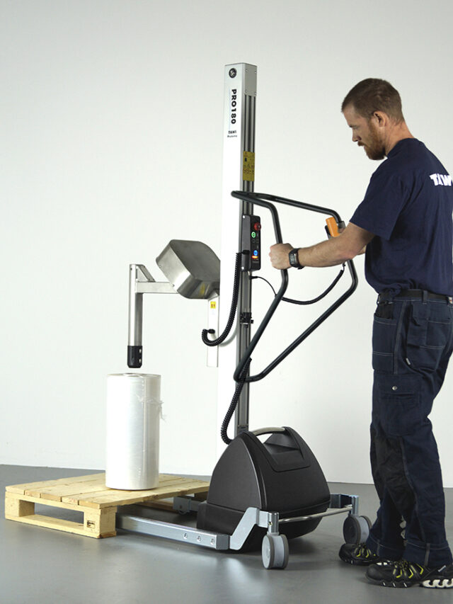 Man lifting and rotate big plastic using a handhold trolley
