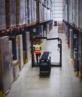 Personnel at Yusen Logistics drive Container Unloaders through the warehouse